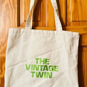 The Vintage Twin Canvas Tote Bag with an interior pocket.